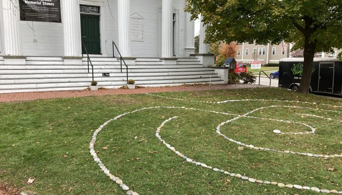 Stones labyrinth in front of church memorializing gun tragedies.